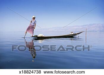 Stock Photo - man rowing a fishing 
boat, inle lake, 
burma. fotosearch 
- search stock 
photos, pictures, 
images, and photo 
clipart