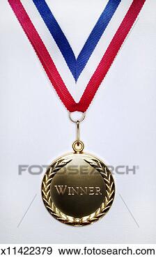 Stock Photograph - gold medal on 
a white background 
engraved with 
the single word 
winner. fotosearch 
- search stock 
photos, pictures, 
images, and photo 
clipart