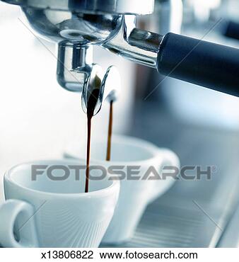 Stock Photo - close-up of a 
coffee maker pouring 
coffee into two 
espresso cups. 
fotosearch - search 
stock photos, 
pictures, images, 
and photo clipart