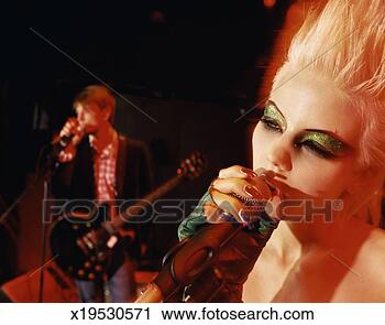 Stock Photography - close-up of a 
female rock band 
singer with glittery 
eyeshadow and 
a. fotosearch 
- search stock 
photos, pictures, 
images, and photo 
clipart