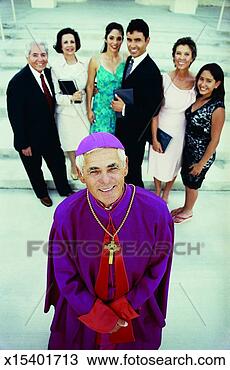 Stock Photo - portrait of a 
priest in purple 
robes standing 
in front of a 
family of. fotosearch 
- search stock 
photos, pictures, 
images, and photo 
clipart