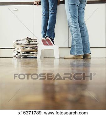 Stock Photograph - low section of 
a mother with 
her child standing 
in a kitchen, 
 child. fotosearch 
- search stock 
photos, pictures, 
images, and photo 
clipart
