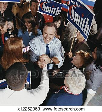 Stock Photo - american politician 
meeting supporters 
at a political 
rally. fotosearch 
- search stock 
photos, pictures, 
images, and photo 
clipart