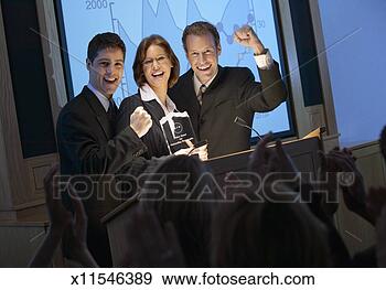 Stock Photograph - businesspeople 
celebrating at 
an award ceremony. 
fotosearch - search 
stock photos, 
pictures, images, 
and photo clipart