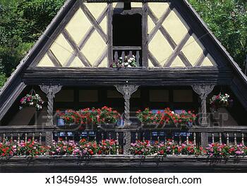 Stock Image - flowers on the 
balcony of an 
old fashioned 
building, alsace, 
france. fotosearch 
- search stock 
photos, pictures, 
images, and photo 
clipart