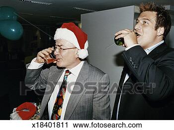 Stock Photography - male colleagues 
drink in unison 
at the christmas 
office party. 
fotosearch - search 
stock photos, 
pictures, images, 
and photo clipart
