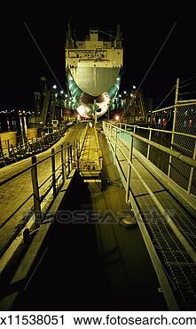 Stock Photography - night time shot 
of a ship being 
built in dry dock. 
fotosearch - search 
stock photos, 
pictures, images, 
and photo clipart