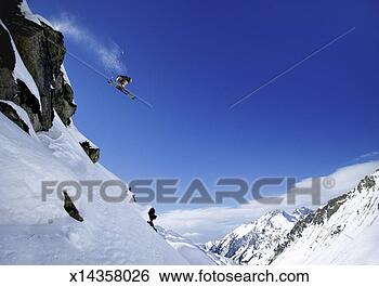 Stock Photo - skiier jumps from 
rock face of mountain 
summit,  st christoph. 
fotosearch - search 
stock photos, 
pictures, images, 
and photo clipart