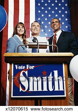 Stock Image - american politicans 
standing behind 
a podium during 
a political rally. 
fotosearch - search 
stock photos, 
pictures, images, 
and photo clipart