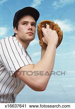 Stock Photography - professional baseball 
pitcher preparing 
to pitch a baseball. 
fotosearch - search 
stock photos, 
pictures, images, 
and photo clipart
