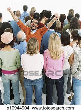 Stock Photo - studio shot of 
a joyful man standing 
in a crowd of 
people with their. 
fotosearch - search 
stock photos, 
pictures, images, 
and photo clipart