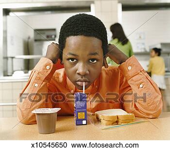 Stock Photography - portrait of a 
primary schoolboy 
with an unhealthy 
packed lunch. 
fotosearch - search 
stock photos, 
pictures, images, 
and photo clipart
