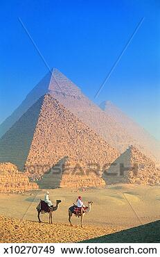 Stock Photograph - two people sitting 
on camels in front 
of the great pyramids, 
 giza. fotosearch 
- search stock 
photos, pictures, 
images, and photo 
clipart