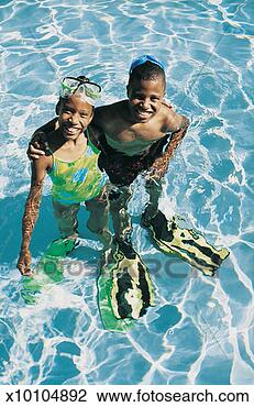 Stock Photo - brother and sister 
standing side 
by side in a swimming 
pool wearing. 
fotosearch - search 
stock photos, 
pictures, images, 
and photo clipart
