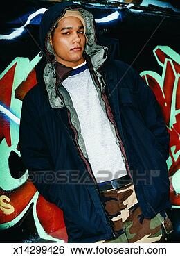Stock Photo - teenage boy standing 
in front of graffiti 
looking suspiciously 
at. fotosearch 
- search stock 
photos, pictures, 
images, and photo 
clipart