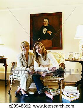 Stock Photo - two women sit 
on an old sofa, 
domestic interior. 
fotosearch - search 
stock photos, 
pictures, images, 
and photo clipart