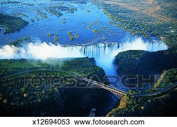 Stock Photo - victoria falls 
and suspension 
bridge over zambesi 
river at dusk. 
fotosearch - search 
stock photos, 
pictures, images, 
and photo clipart