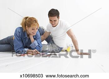 Stock Photo - couple looking 
at colour swatches 
in a white room. 
fotosearch - search 
stock photos, 
pictures, images, 
and photo clipart