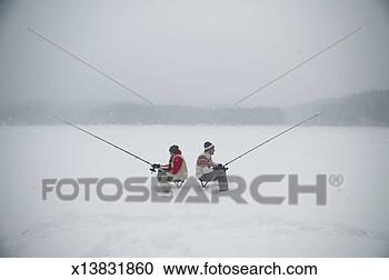Stock Photography - father and teenage 
son (13-15) with 
fishing rods on 
frozen lake. fotosearch 
- search stock 
photos, pictures, 
images, and photo 
clipart