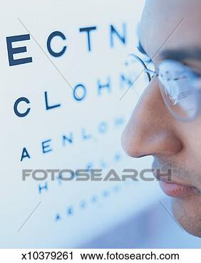 Stock Photography - man wearing spectacles 
next to a sight 
test chart. fotosearch 
- search stock 
photos, pictures, 
images, and photo 
clipart