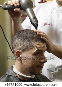 Stock Photography - barber drying 
man's hair with 
hair dryer, close-up. 
fotosearch - search 
stock photos, 
pictures, images, 
and photo clipart