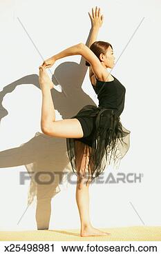 Stock Photography - young woman in 
shiva posture, 
side view. fotosearch 
- search stock 
photos, pictures, 
images, and photo 
clipart