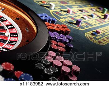 Stock Photo - gambling chips 
stacked around 
roulette wheel 
on gaming table. 
fotosearch - search 
stock photos, 
pictures, images, 
and photo clipart