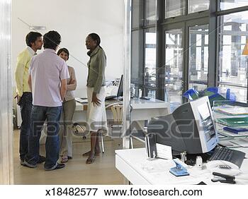 Picture - four office workers 
talking in office. 
fotosearch - search 
stock photos, 
pictures, images, 
and photo clipart