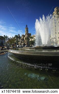 Stock Photo - spain, valencia, 
fountain in plaza 
del ayuntamiento. 
fotosearch - search 
stock photos, 
pictures, images, 
and photo clipart