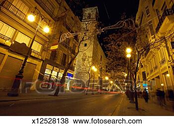 Stock Photo - spain, valencia, 
lights of car 
passing through 
street, night. 
fotosearch - search 
stock photos, 
pictures, images, 
and photo clipart