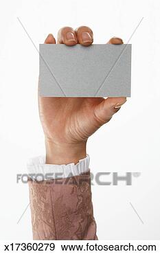 Stock Photograph - woman holding 
business card 
(focus on business 
card). fotosearch 
- search stock 
photos, pictures, 
images, and photo 
clipart