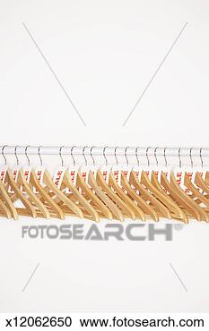 Stock Photography - clothes hangers 
with sale tags 
attached on clothes 
rail. fotosearch 
- search stock 
photos, pictures, 
images, and photo 
clipart