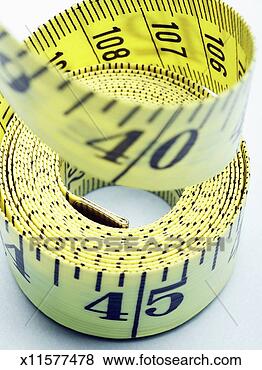 Stock Photo - coiled up tape 
measure, close 
up, close-up, 
high angle view. 
fotosearch - search 
stock photos, 
pictures, images, 
and photo clipart