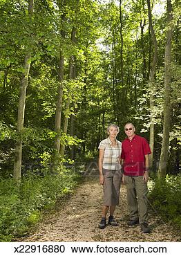Stock Photography - mature couple 
on forest path. 
fotosearch - search 
stock photos, 
pictures, images, 
and photo clipart