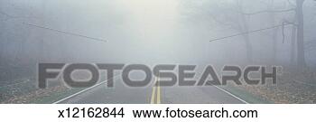 Stock Photo - this is fossy 
road in a fog 
 it signifies 
hazardous driving. 
fotosearch - search 
stock photos, 
pictures, images, 
and photo clipart