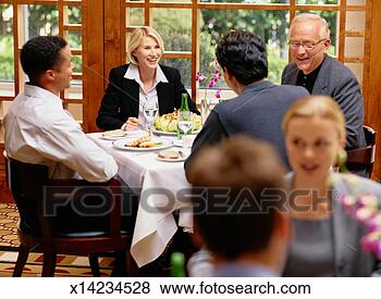 Stock Photo - business people 
talking at a business 
lunch. fotosearch 
- search stock 
photos, pictures, 
images, and photo 
clipart
