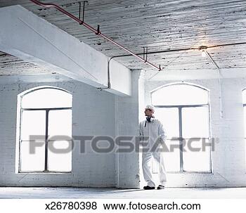 Stock Photo - man wearing a 
hazardous materials 
suit in an abandoned 
factory. fotosearch 
- search stock 
photos, pictures, 
images, and photo 
clipart