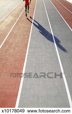 Stock Photograph - athlete running 
on track, low 
section. fotosearch 
- search stock 
photos, pictures, 
images, and photo 
clipart