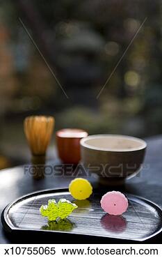 Stock Image - colourful japanese 
jelly sweets in 
front of tea cups. 
fotosearch - search 
stock photos, 
pictures, images, 
and photo clipart
