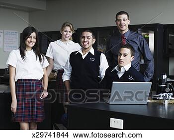 Stock Photo - group of young 
students (16-17) 
with teacher in 
classroom lab. 
fotosearch - search 
stock photos, 
pictures, images, 
and photo clipart