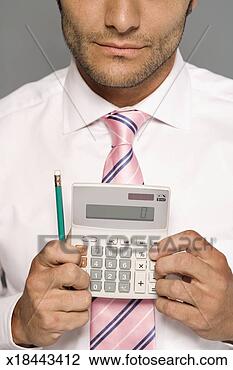 Stock Photo - man in shirt and 
tie holding calculator, 
mid section. fotosearch 
- search stock 
photos, pictures, 
images, and photo 
clipart