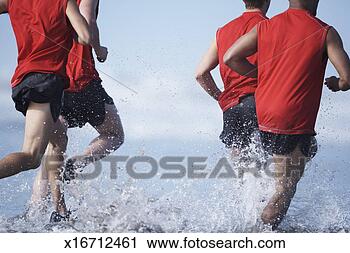 Stock Photography - men running in 
ocean, low section. 
fotosearch - search 
stock photos, 
pictures, images, 
and photo clipart