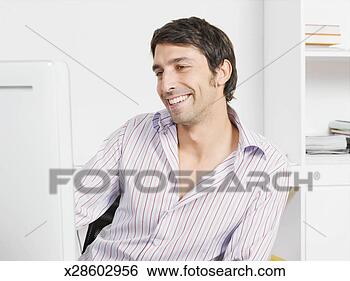 Stock Photo - office worker 
using computer 
in office. fotosearch 
- search stock 
photos, pictures, 
images, and photo 
clipart