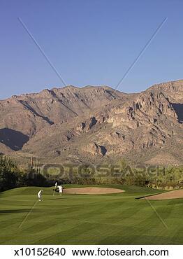 Stock Photography - people on golf 
course near sand 
traps. fotosearch 
- search stock 
photos, pictures, 
images, and photo 
clipart