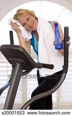 Stock Photo - portrait of mature 
woman relaxing 
after exercises, 
health club. fotosearch 
- search stock 
photos, pictures, 
images, and photo 
clipart