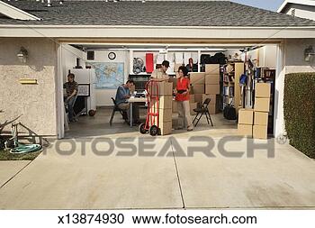 Stock Photography - small company 
in garage, woman 
receiving delivery. 
fotosearch - search 
stock photos, 
pictures, images, 
and photo clipart