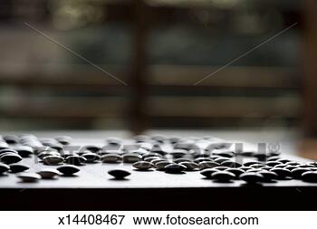 Picture - table game of 
go, close up of 
go stones. fotosearch 
- search stock 
photos, pictures, 
images, and photo 
clipart