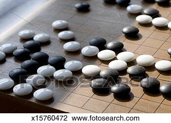Stock Photo - table game of 
go, close up of 
go stones. fotosearch 
- search stock 
photos, pictures, 
images, and photo 
clipart