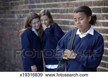 Stock Photograph - two school girls 
(11-12) whispering 
and laughing at 
another girl. 
fotosearch - search 
stock photos, 
pictures, images, 
and photo clipart