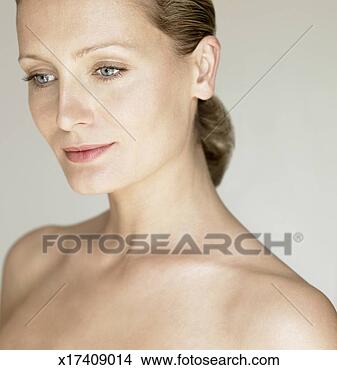 Stock Photo - woman in studio, 
head and shoulders. 
fotosearch - search 
stock photos, 
pictures, images, 
and photo clipart
